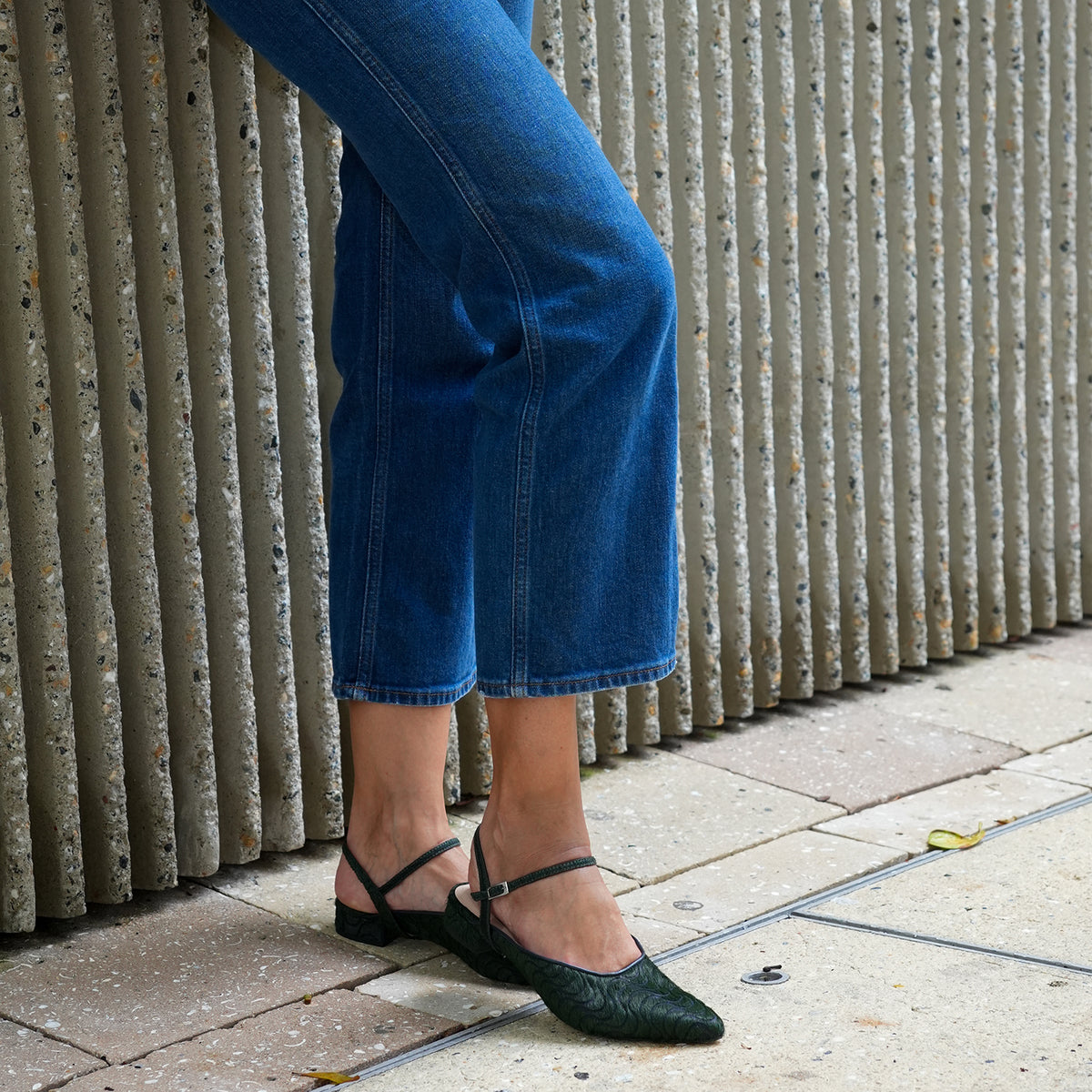 Groovy Green Point Slide + Amal Strap by Alterre, featuring laser engraved calf hair upper and leather lining with eco-leather composite sole, a 3/4-inch heel, a cushioned foam insole, and detachable strap styling.