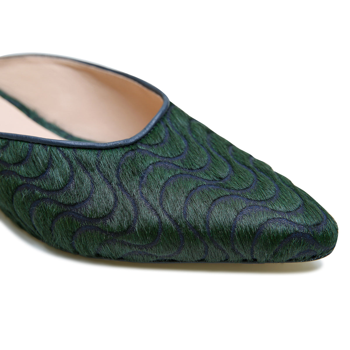 Groovy Green Point Slide by Alterre, featuring laser engraved calf hair upper and leather lining with eco-leather composite sole, a 3/4-inch heel, a cushioned foam insole, and interchangeable strap compatibility.