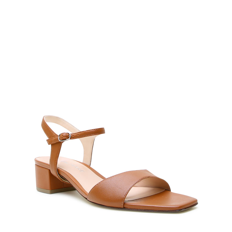 Brown leather square-toe sandal with Jackie ankle straps, eco-leather sole, and low recycled plastic heel for everyday wear.