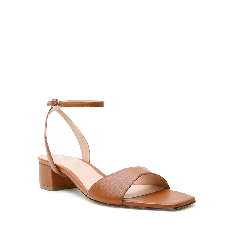 Alterre brown shoe strap inspired by Marilyn Monroe and shown with Cognac Square Sandal sold separately.