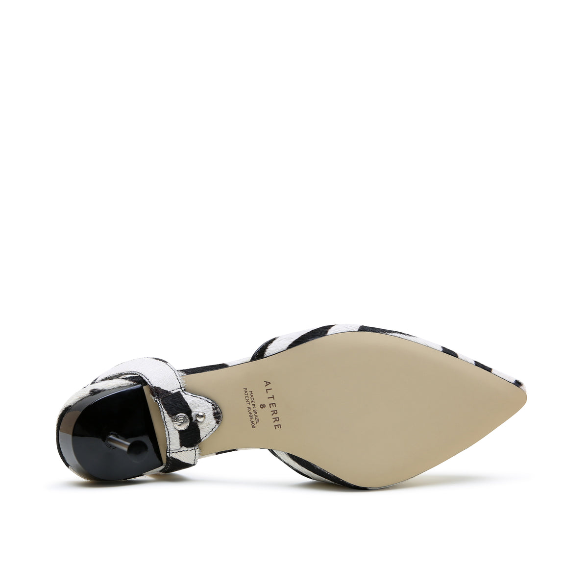 White Zebra Stiletto + Marilyn Strap crafted with foam-padded insole, eco-leather composite sole, and black-and-white zebra printed calf hair upper.