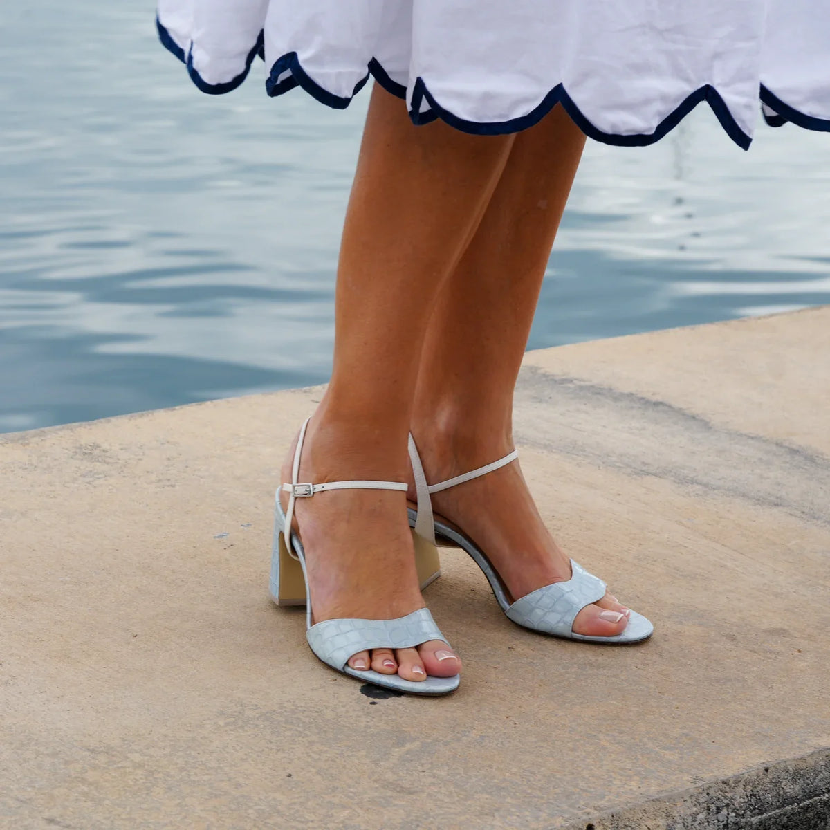 Alterre Blue Viper Wave Sandal paired with White Amal Strap, a comfortable leather dress sandal with a recycled plastic 3-inch heel for summer parties and weddings.