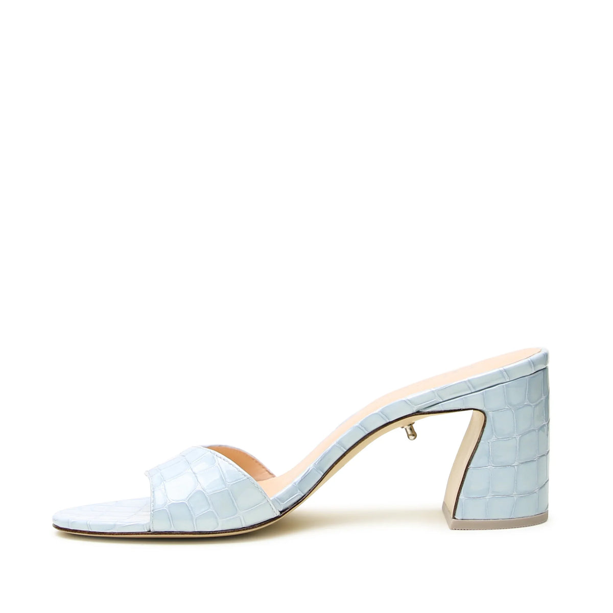Light blue patent croc print block heel leather sandal by Alterre with sculptural wave detail and detachable strap styling.
